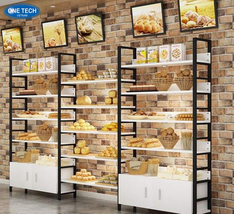 Kệ trưng bày bánh bằng gỗ MDF trắng đơn giản, tinh tế Kệ trưng bày bánh đơn giản làm từ gỗ MDF màu trắng, thiết kế tinh tế và hiện đại, phù hợp cho cửa hàng bánh ngọt